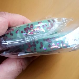 PAIR - Bow  & Crossbones fakelite bangle bracelets